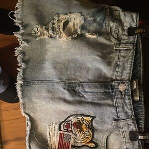 Refuge Distressed Denim Mini Skirt with Tiger Patch